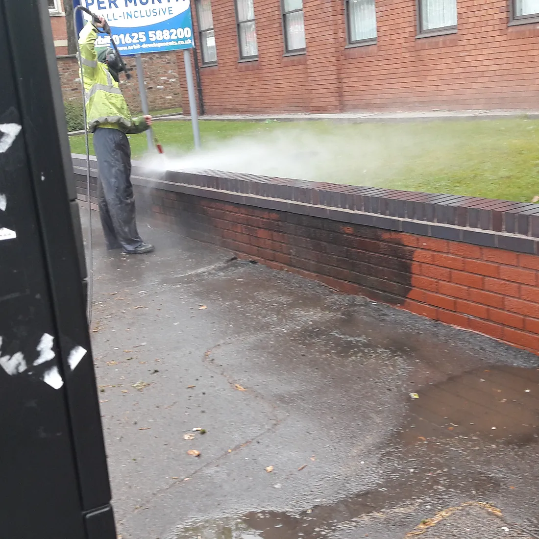 Jet washing a wall