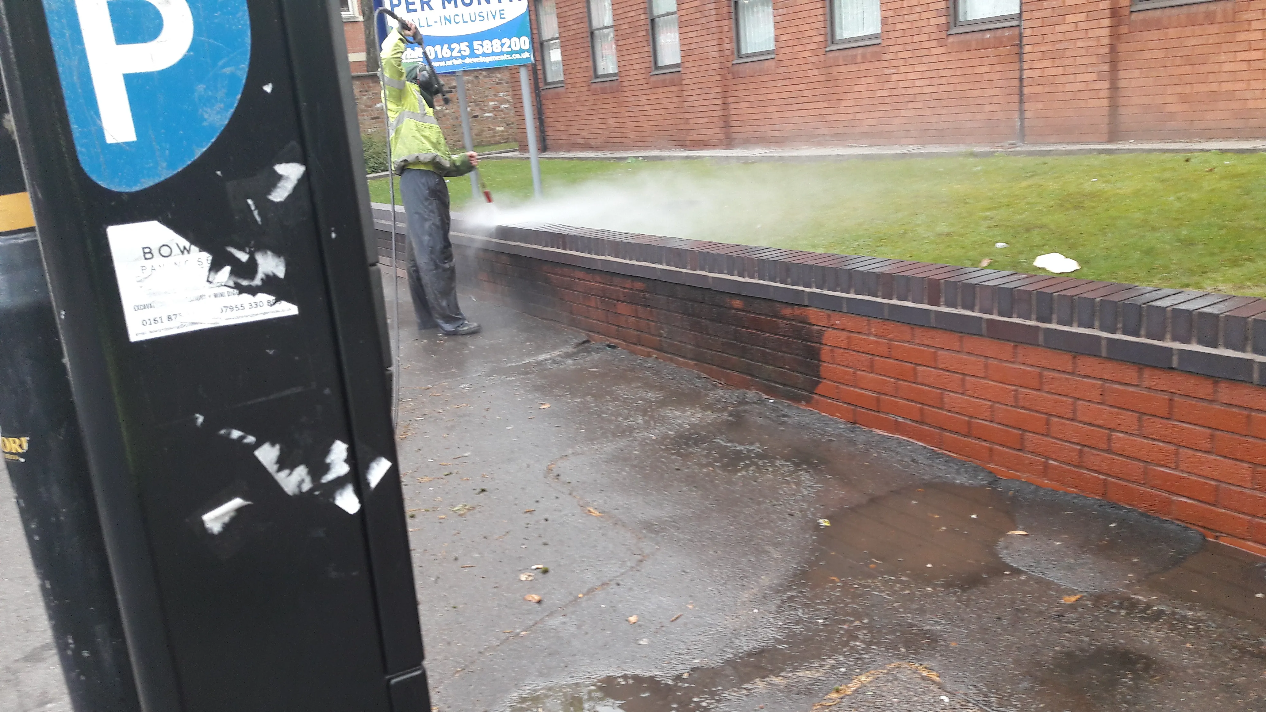 Jet washing a wall